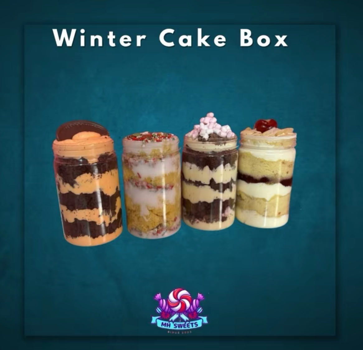 THE MH BAKES WINTER CAKE BOX - 1X CHRISTMAS OLD SCHOOL CAKE JAR - 1X HOT CHOCOLATE CAKE JAR - 1X CHOC ORANGE CAKE JAR AND 1X CHERRY BAKEWELL CAKE JAR